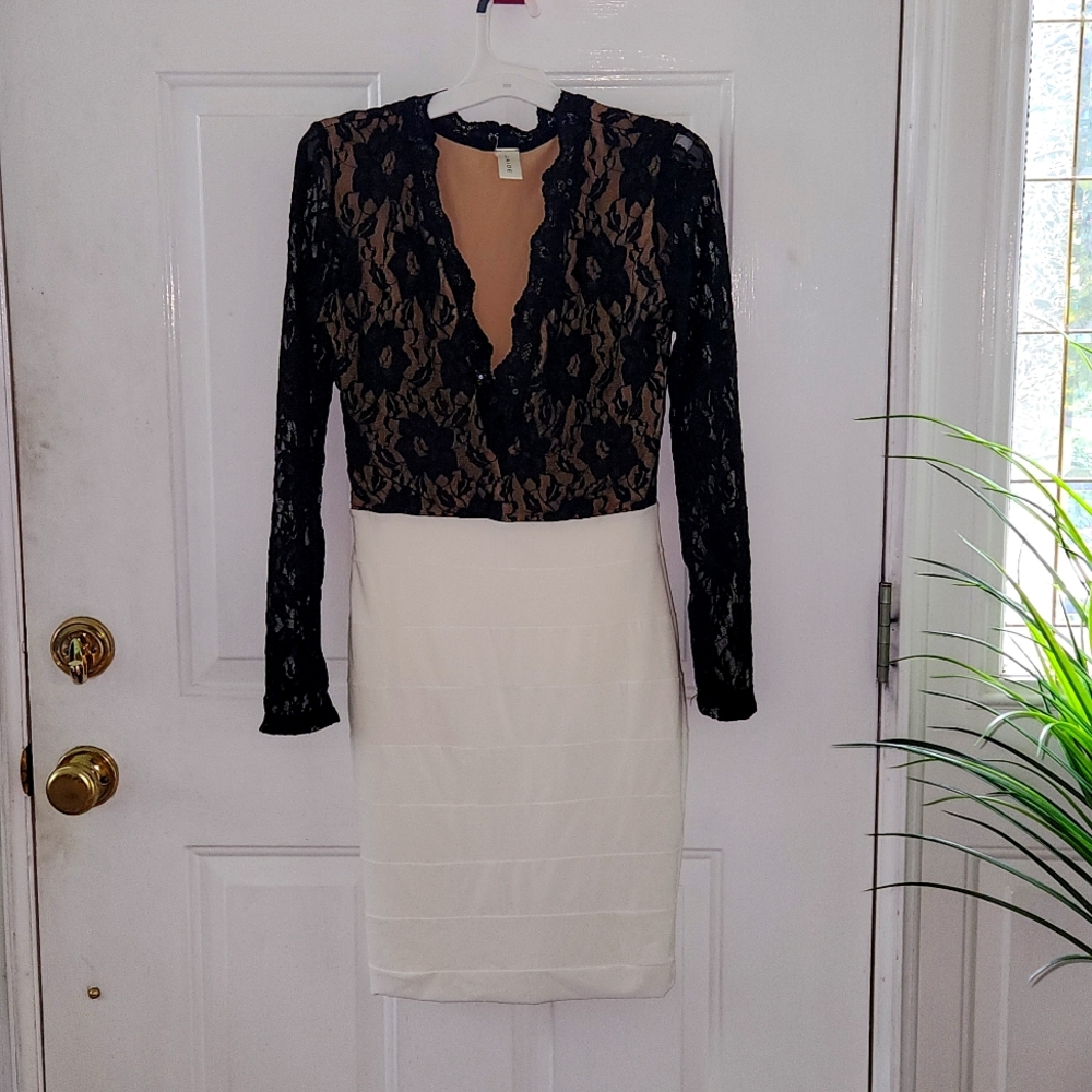 Fitted Woman's Dress, Black Lace top and cream fitted bottom..1 piece.
